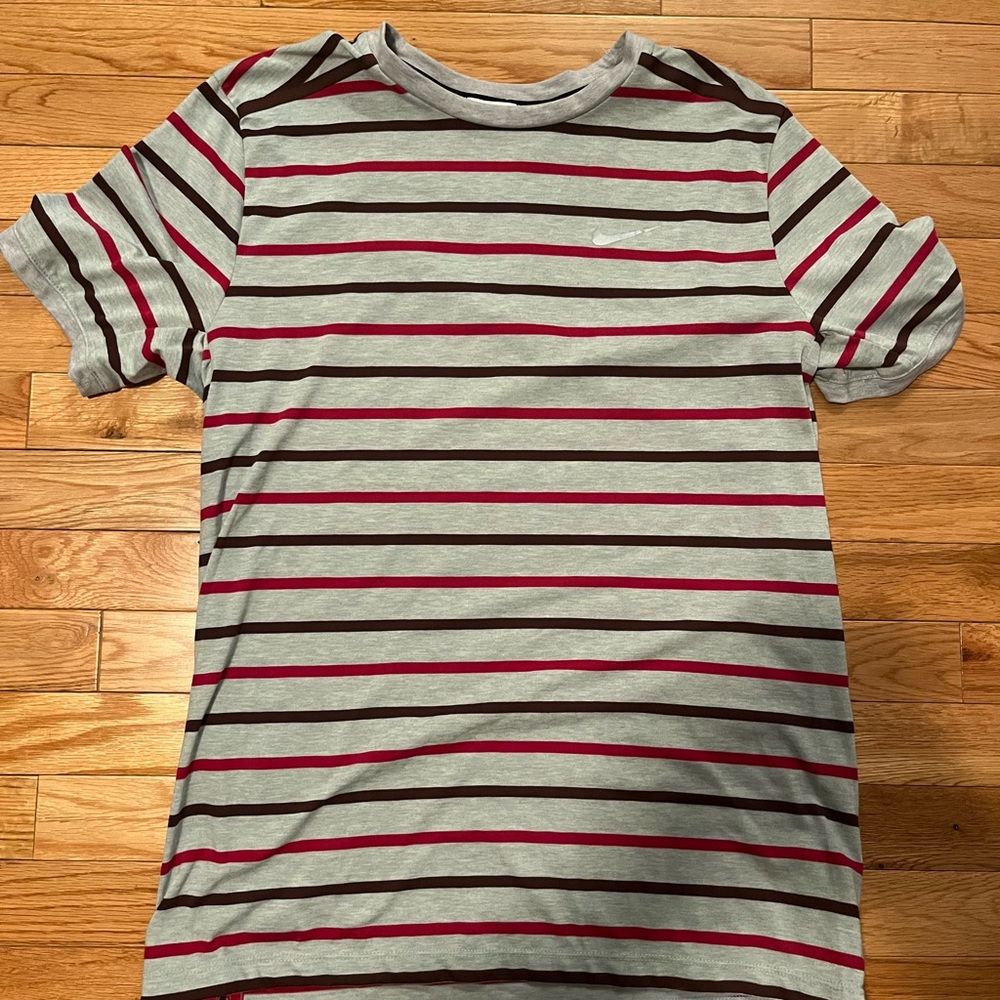 Striped Nike dry fit running shirt with pocket and reflective swoosh